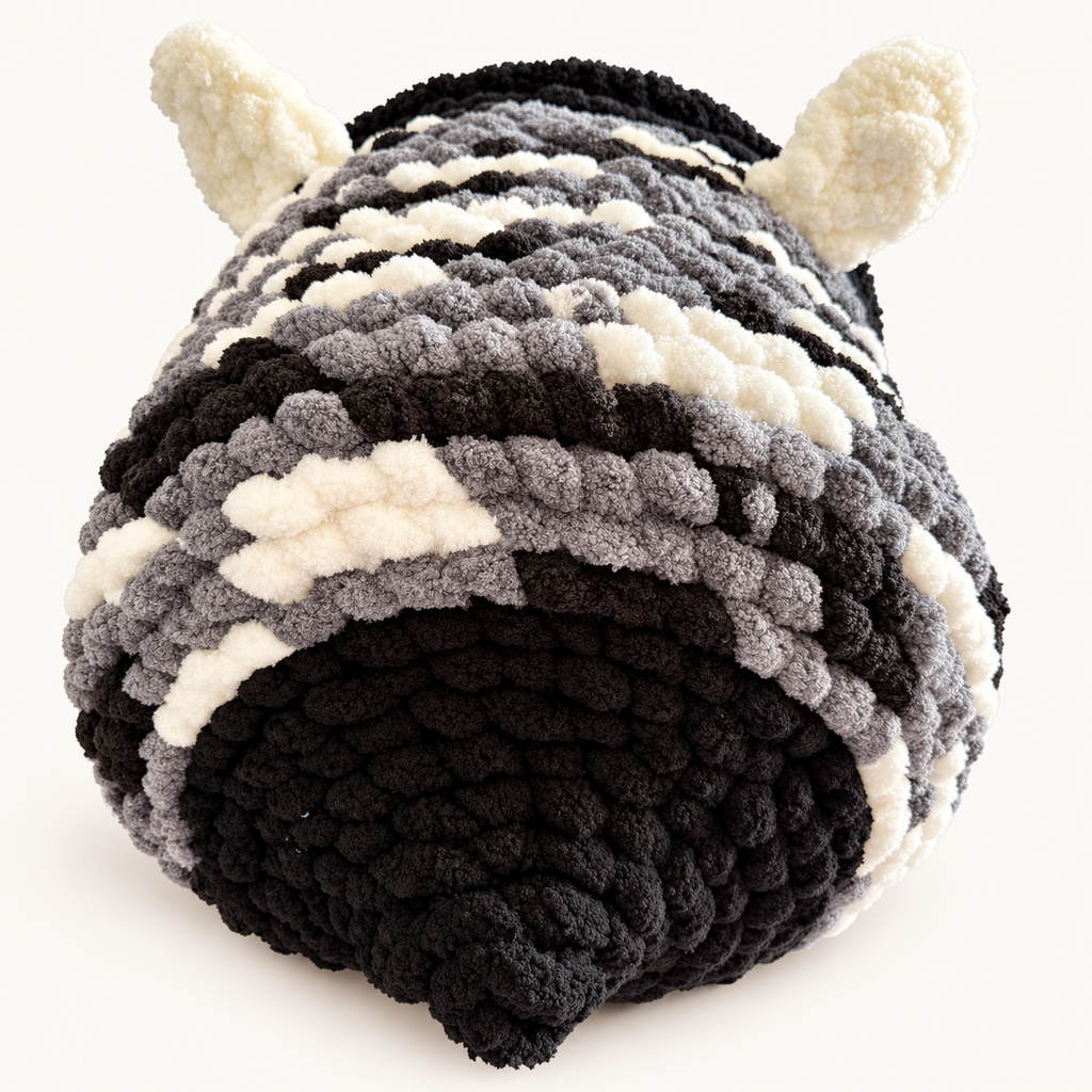 Chunky Knit Cave black, grey and white, back view on warm white background