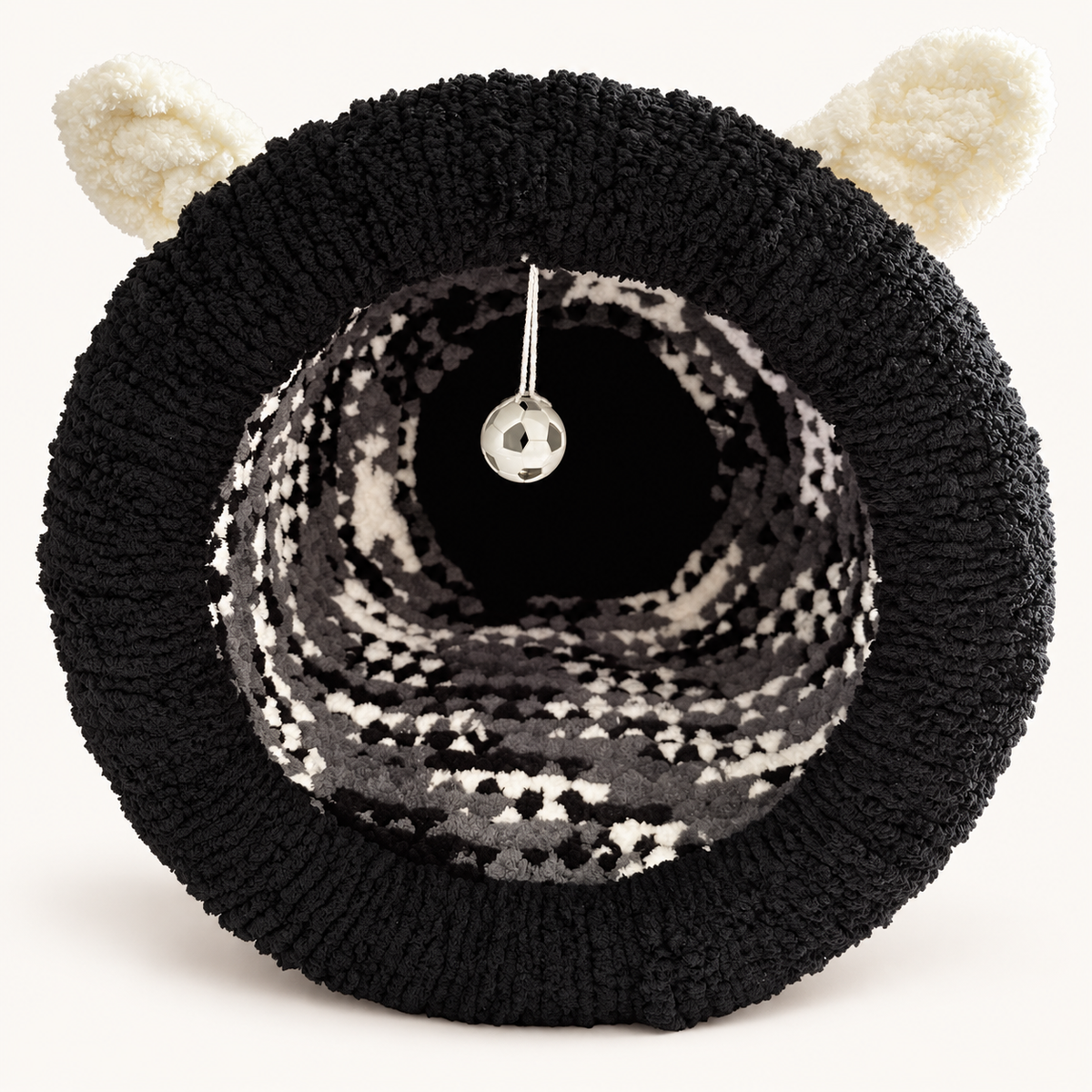 Chunky Knit Cave black, grey and white, front view on warm white background