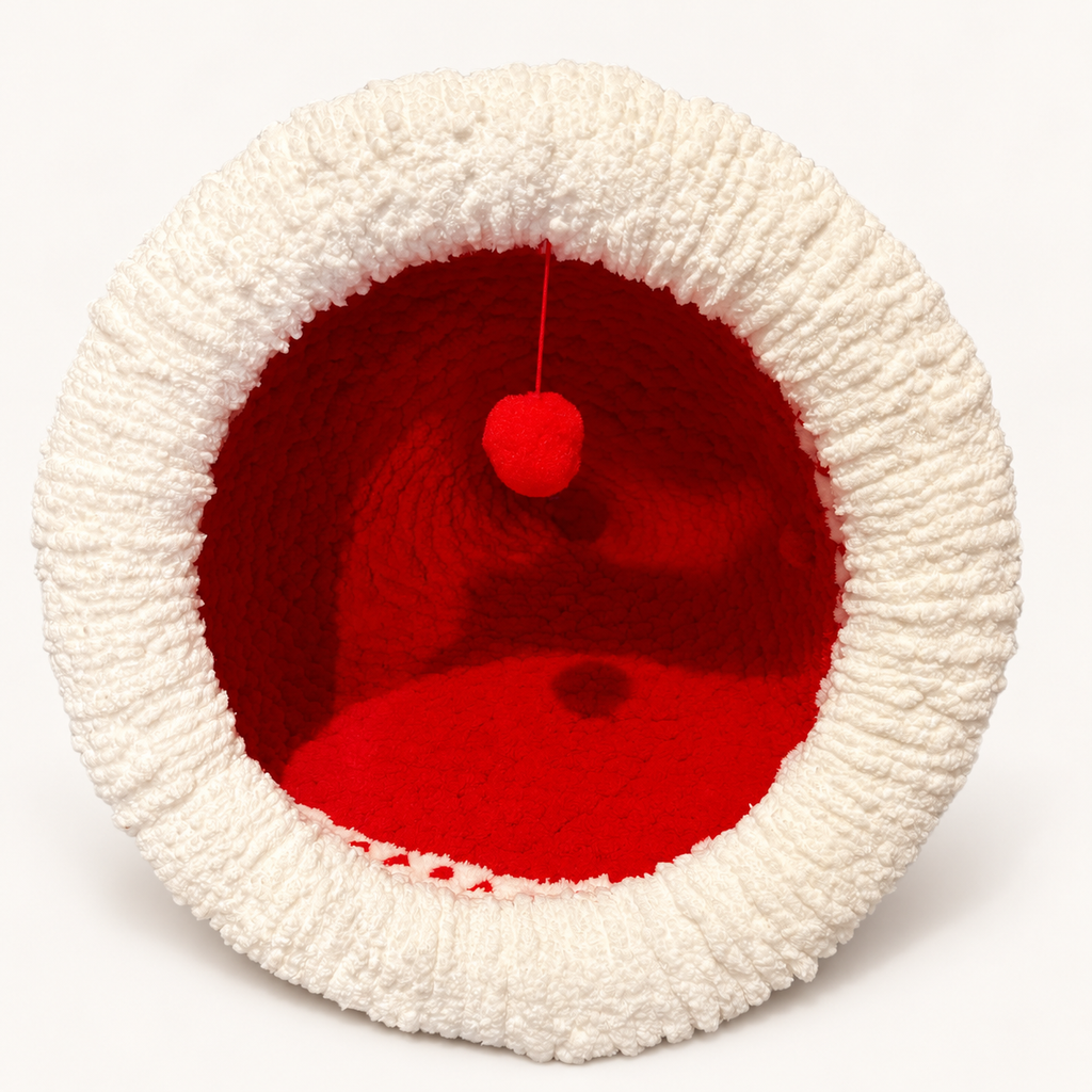 Christmas Chunky Knit Cave in red and white, front view with hanging pom-pom on a warm white background