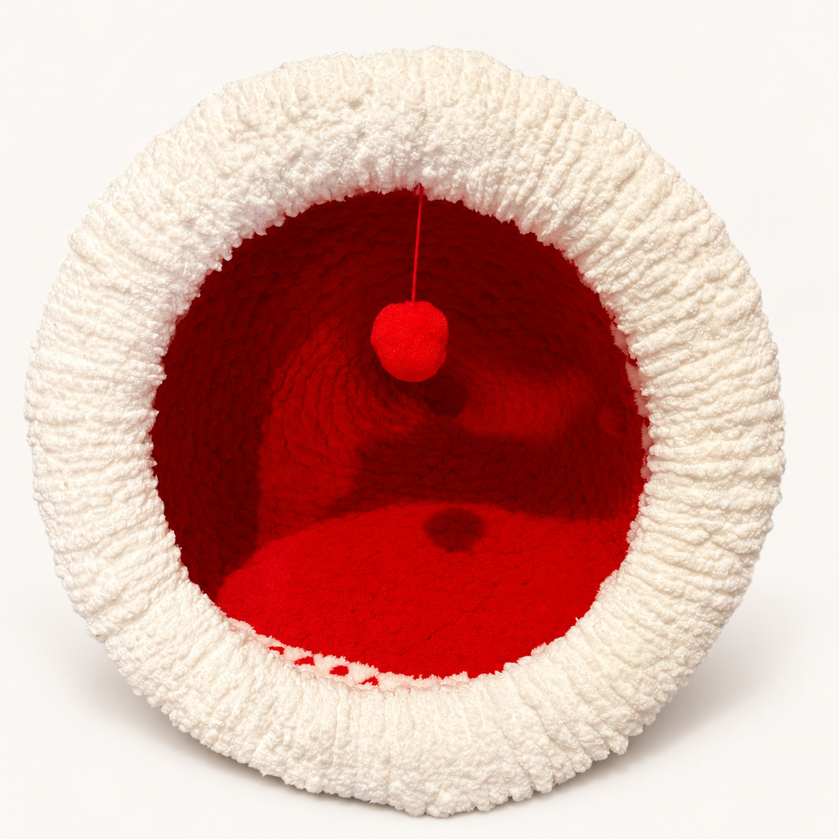 Christmas Chunky Knit Cave in red and white, front view with hanging pom-pom on a warm white background