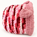Chunky Knit Cave Pink / Red / White side view on warm white background